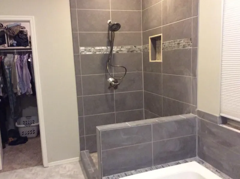 Custom tiled walk-in shower with bench